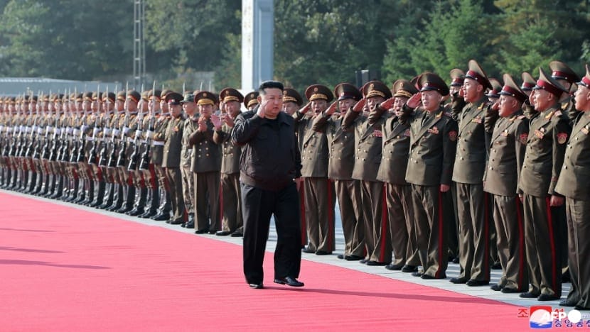 What is being cooking against United States?: Russia & North Korea soldiers on same stage